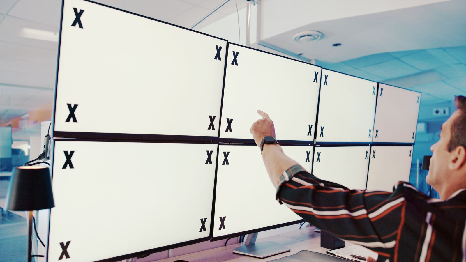 Multiple smart TV screens showing different stages of streaming app development